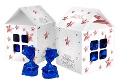 Chocolate pralines in a Christmas house with promotional printing