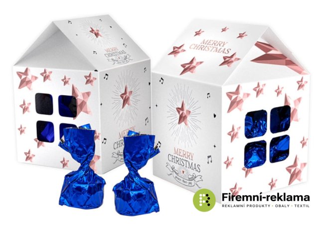 Chocolate pralines in a Christmas house with promotional printing